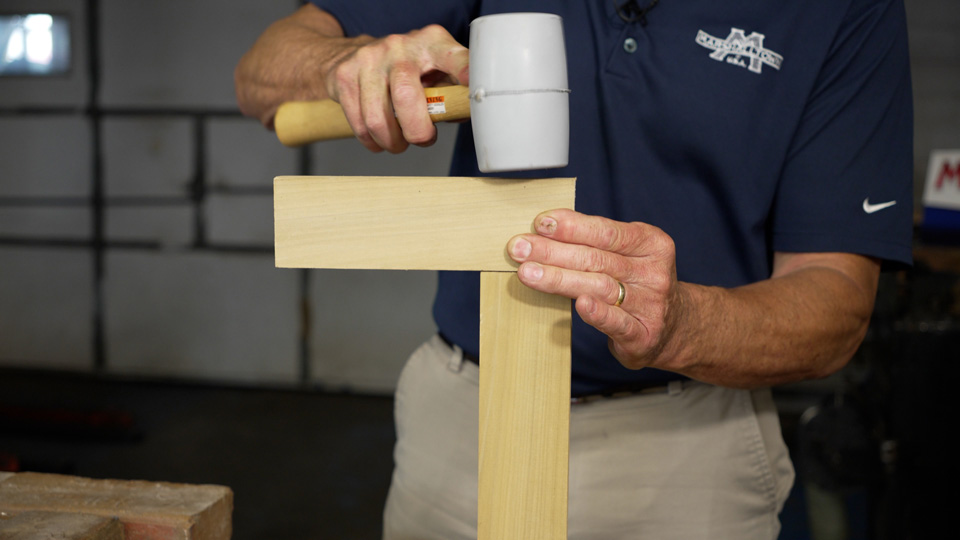 Using the non-marring gray solid rubber mallet for woodworking tasks
